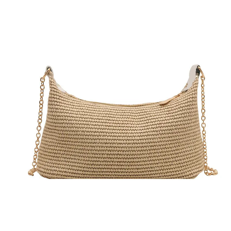 Woven straw shoulder tote bag in a horizontal square shape with a sandwich pocket.