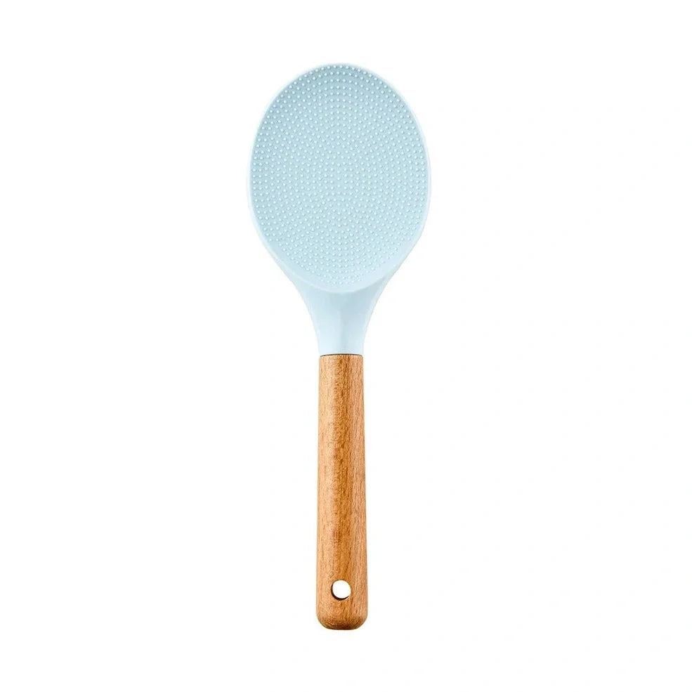 Blue silicone non-stick cookware set with frying spatula, colander, egg beater, and white iron storage bucket for kitchen organisation