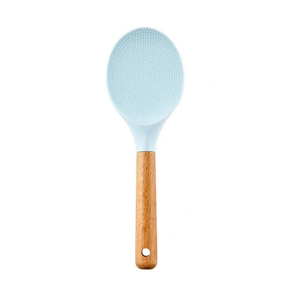 Blue silicone non-stick cookware set with frying spatula, colander, egg beater, and white iron storage bucket for kitchen organisation