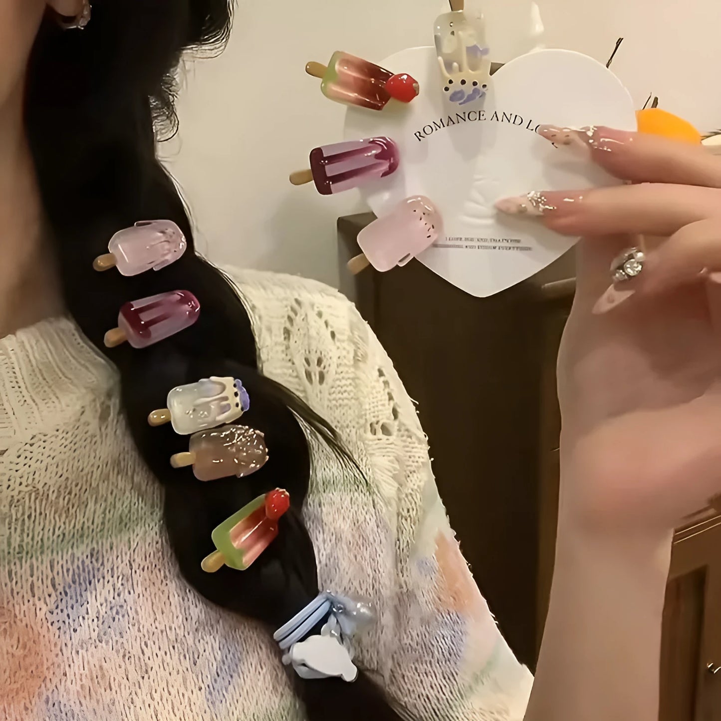 A resin hair barrette with a cartoon ice cream charm on a side-clip, shown in a pink colour variant.