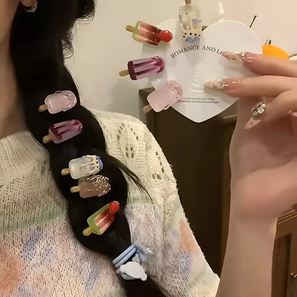 A resin hair barrette with a cartoon ice cream charm on a side-clip, shown in a pink colour variant.