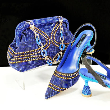 Women's pointed toe high heel court shoes in blue with rhinestone detail and a matching small bag.