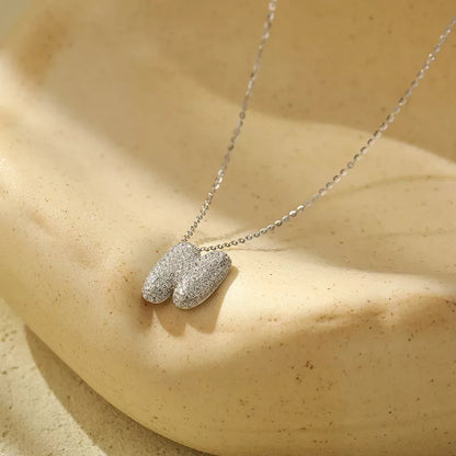 Stainless steel initial pendant necklace with zircon accents, personalized with your choice of letter.