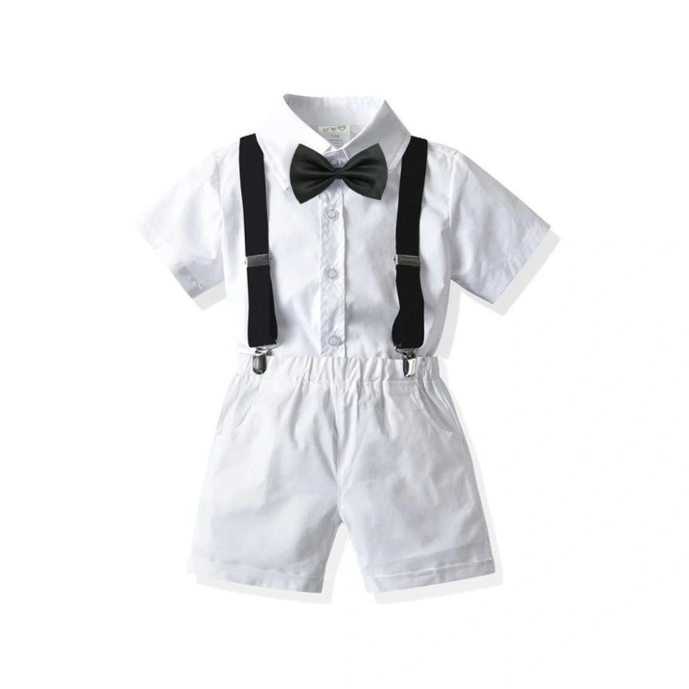 Boys' white short-sleeved shirt with suspender shorts set showing single-breasted closure and adjustable straps