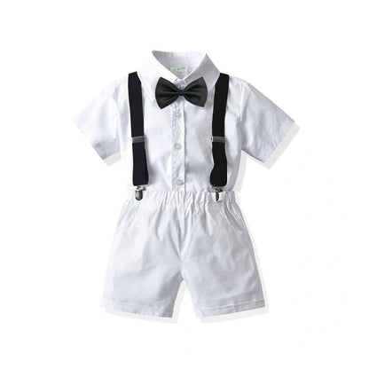 Boys' white short-sleeved shirt with suspender shorts set showing single-breasted closure and adjustable straps