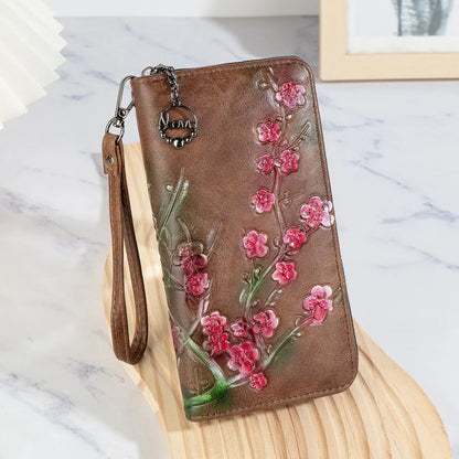 PU leather handbag with embossed floral pattern and zipper closure in Chinese style