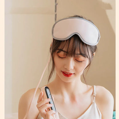 Portable eye SPA mask in pink or green with steam heating and vibration modes for relaxation