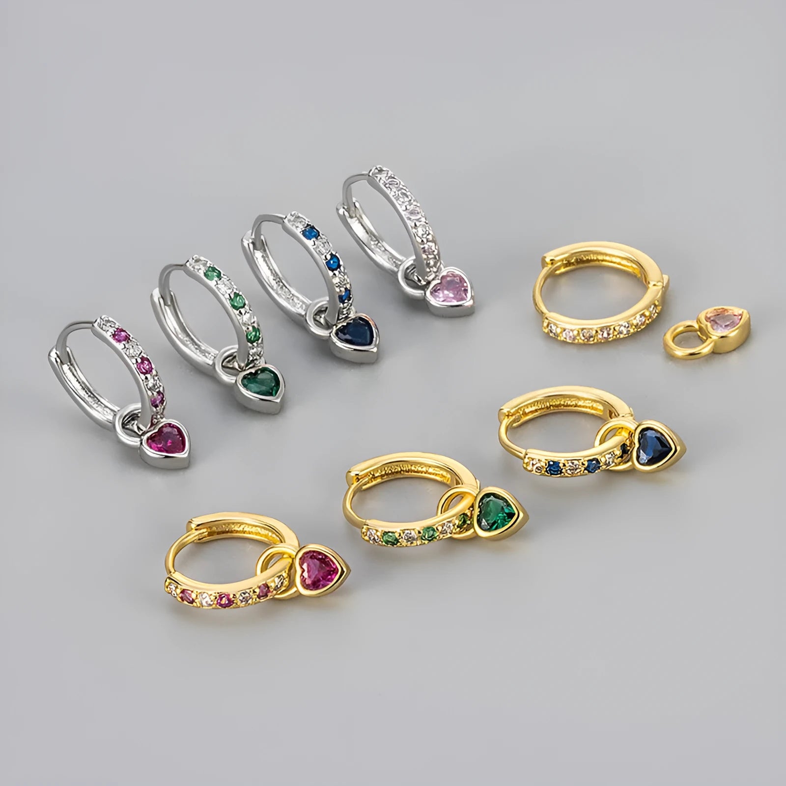 Fashion zircon earrings with 10mm heart-shaped drops in gold and white gold settings, showing diamond-treated stones