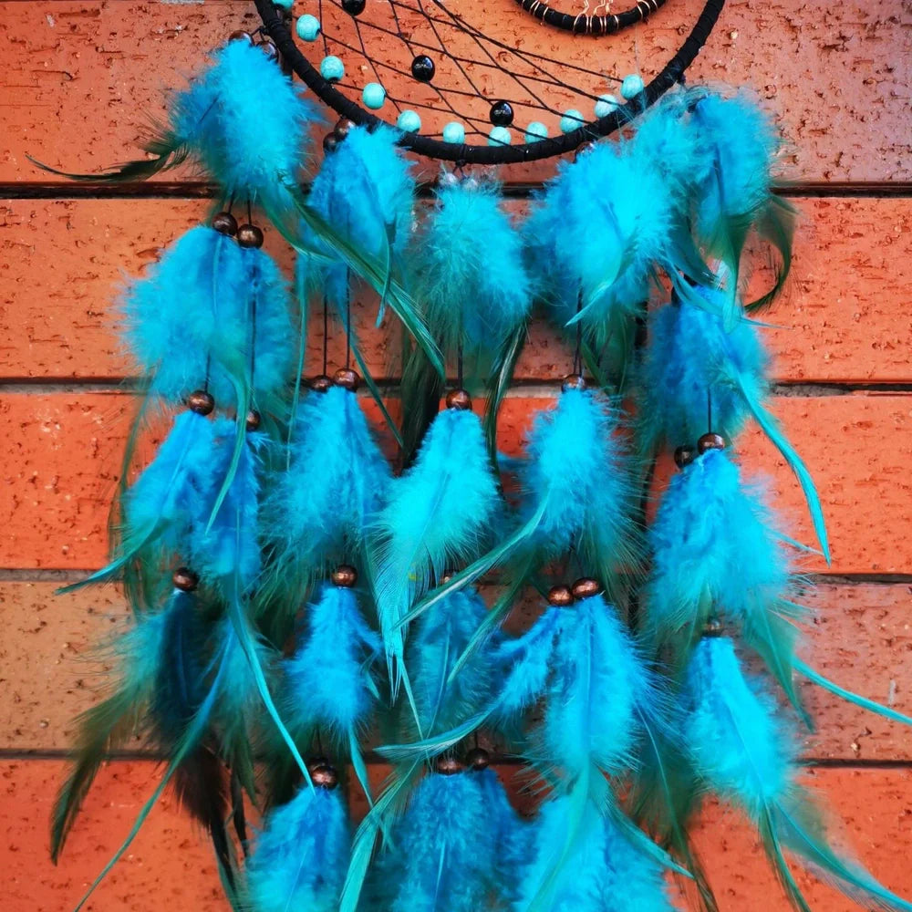 Handmade feather dream catcher wall art with 16cm circular frame and natural materials