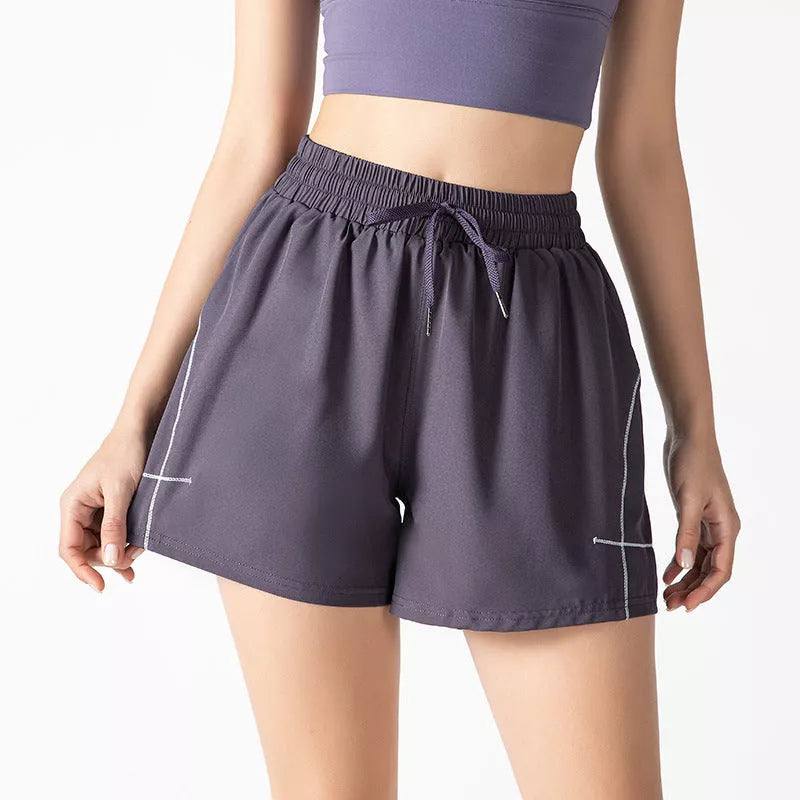 Women's fitness shorts in purple, black, and Brassica oleracea colors, sizes S to XL