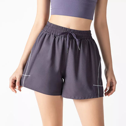 Women's fitness shorts in purple, black, and Brassica oleracea colors, sizes S to XL