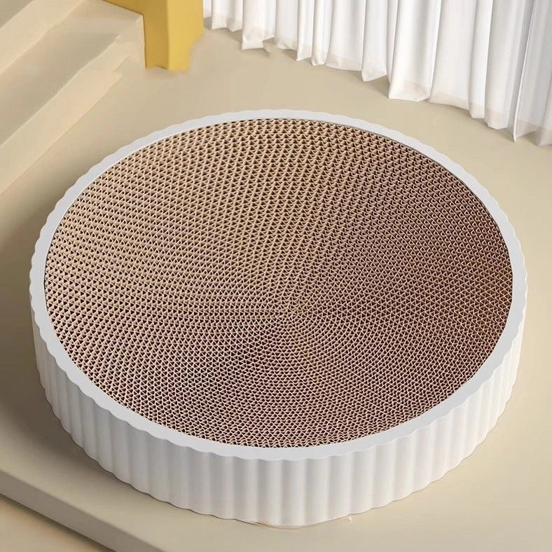 Green round cat scratching board measuring 55cm with corrugated paper surface and two replacement inserts