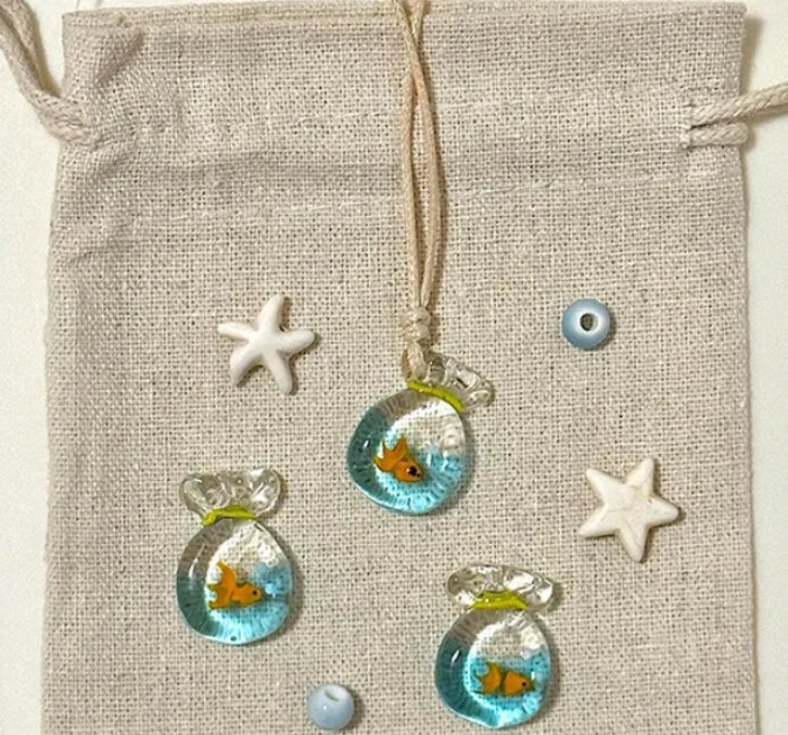 Women's necklace with coloured glaze pendant on a cotton-linen chain, showcasing world-style design