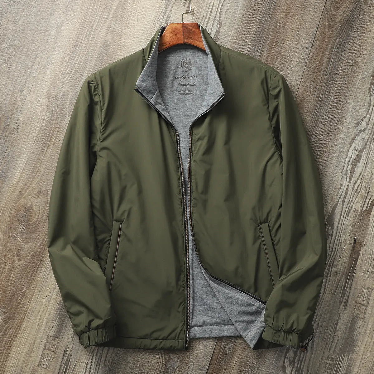 Men's simple stand collar casual jacket in army green, shown on a model.