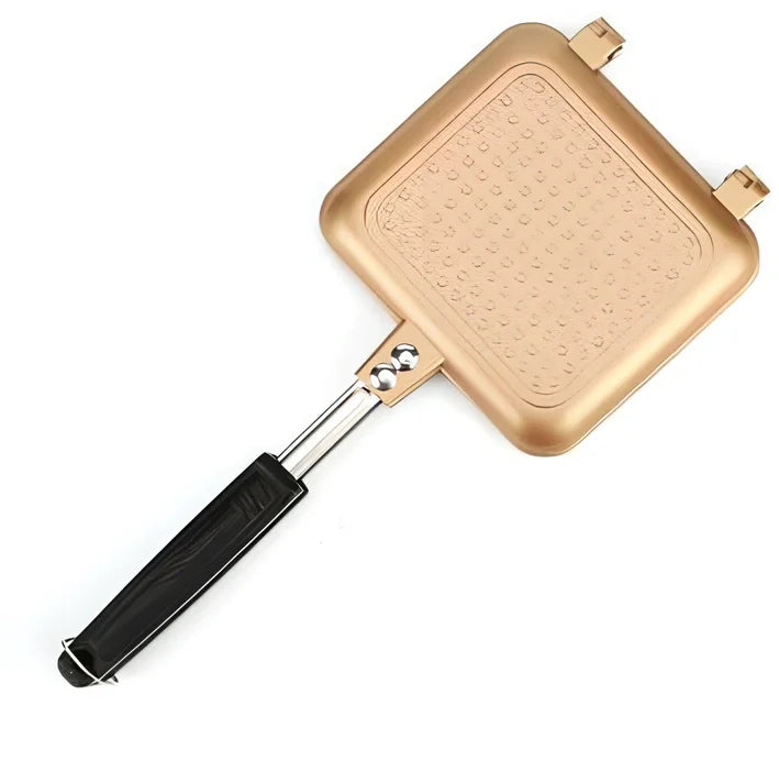 Black double-sided sandwich frying pan with heat-proof handle on stovetop