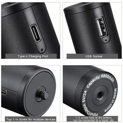 Black aluminium alloy portable power bank with an integrated carry handle, shown next to a smartphone for scale.
