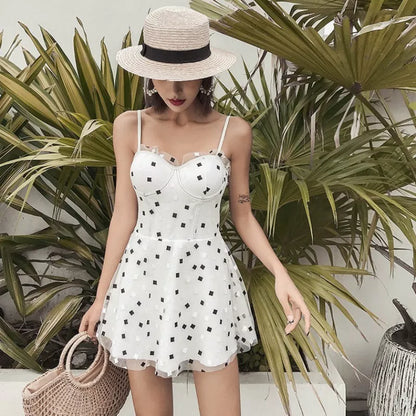 One-piece swimwear in white and black, made from 100% polypropylene for water resistance