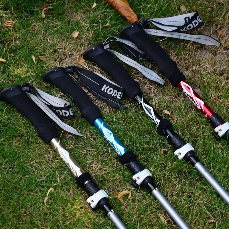 Five-section folding trekking pole in red, blue, black, or gold with adjustable length and diamond tip