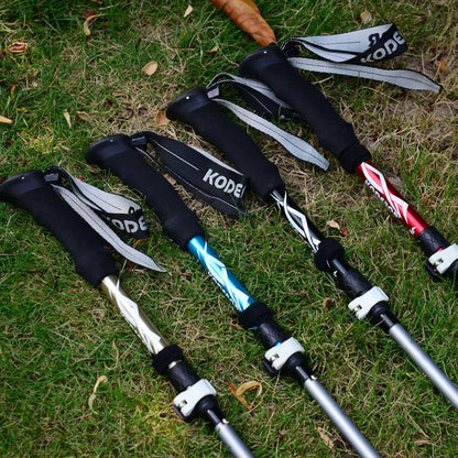 Five-section folding trekking pole in red, blue, black, or gold with adjustable length and diamond tip