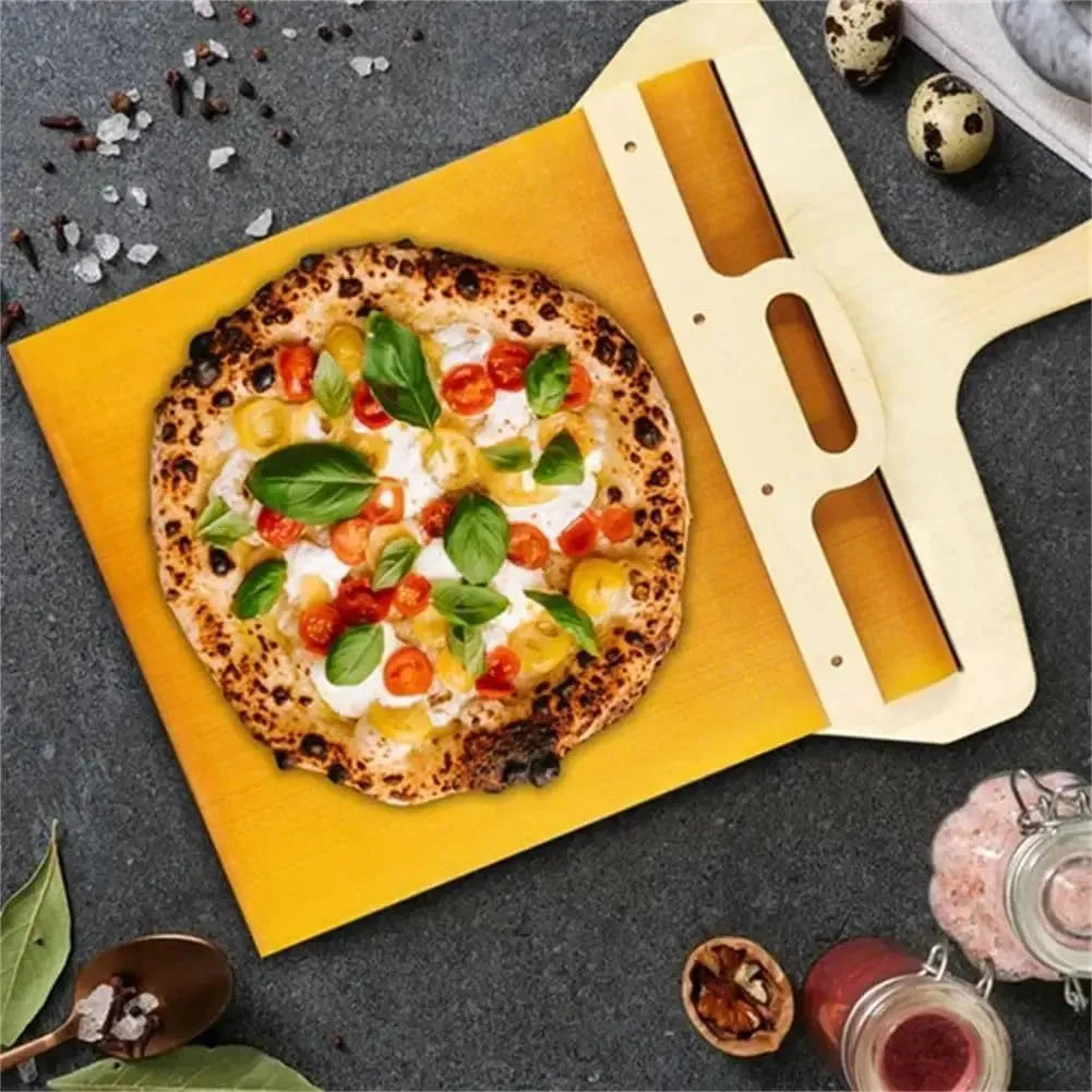 White PP plastic pizza transfer shovel measuring 55cm by 35cm on kitchen counter