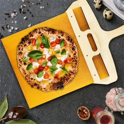 White PP plastic pizza transfer shovel measuring 55cm by 35cm on kitchen counter