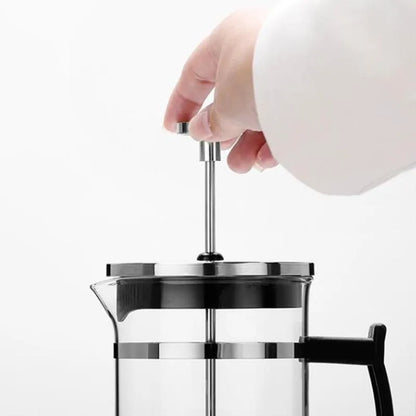 Compact manual pour over coffee maker with glass carafe and stainless steel filter, showing 350ml capacity.
