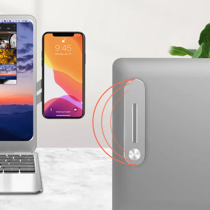 Silver aluminium alloy laptop side mount bracket holding a mobile phone next to a laptop screen.