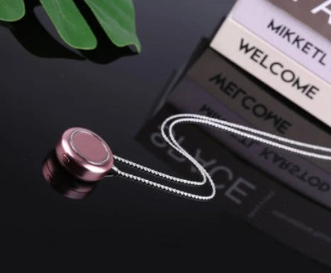 Portable negative ion air purifier necklace in blue, white, and silver