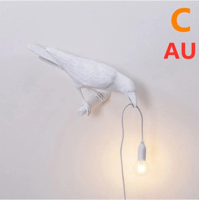 Elegant Resin Bird Wall Lamp illuminating a cozy room with its unique design
