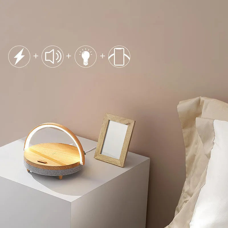 Wireless charging LED night light with Bluetooth 5.0 speaker and phone holder, 10W rated power and 5W wireless charging for phones, made from ABS and PP, features overcharge protection and available in marble pattern or wood grain colours