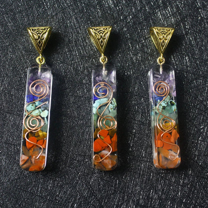 A stylish 7-chakra crystal pendant featuring a unique geometric design and natural stone patterns