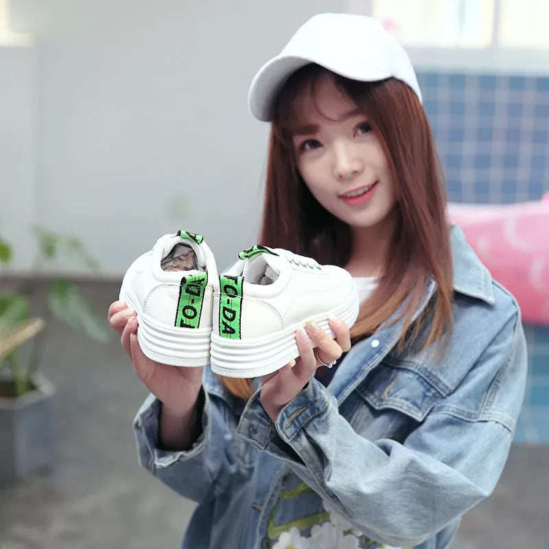 Breathable women's sneakers in black, green, and pink with rubber outsole