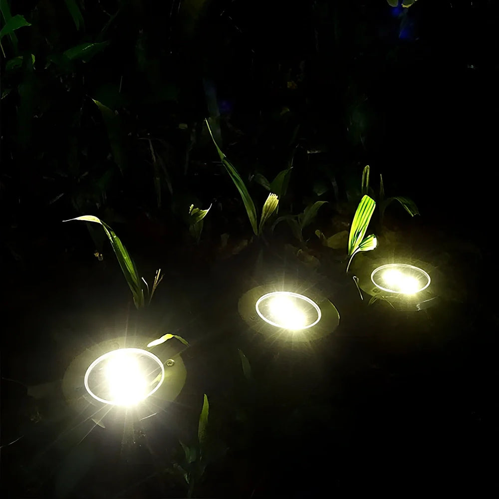 Stainless steel solar garden light measuring 11.5x11.5x13cm with automatic dusk operation