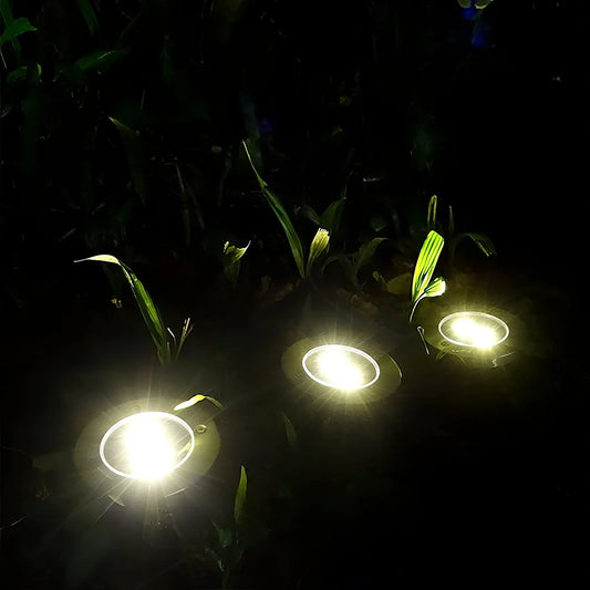 Stainless steel solar garden light measuring 11.5x11.5x13cm with automatic dusk operation