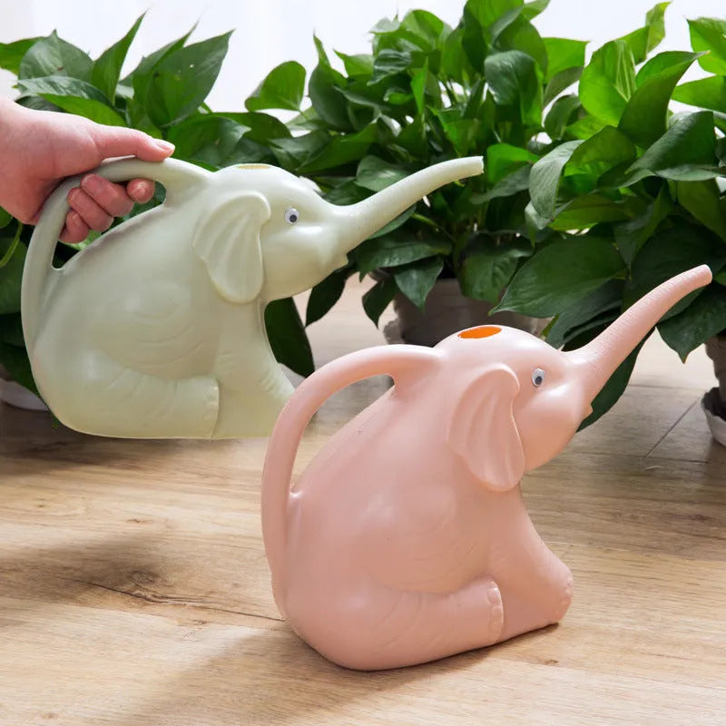 Pink elephant-shaped watering can with long nozzle for children and indoor plants.