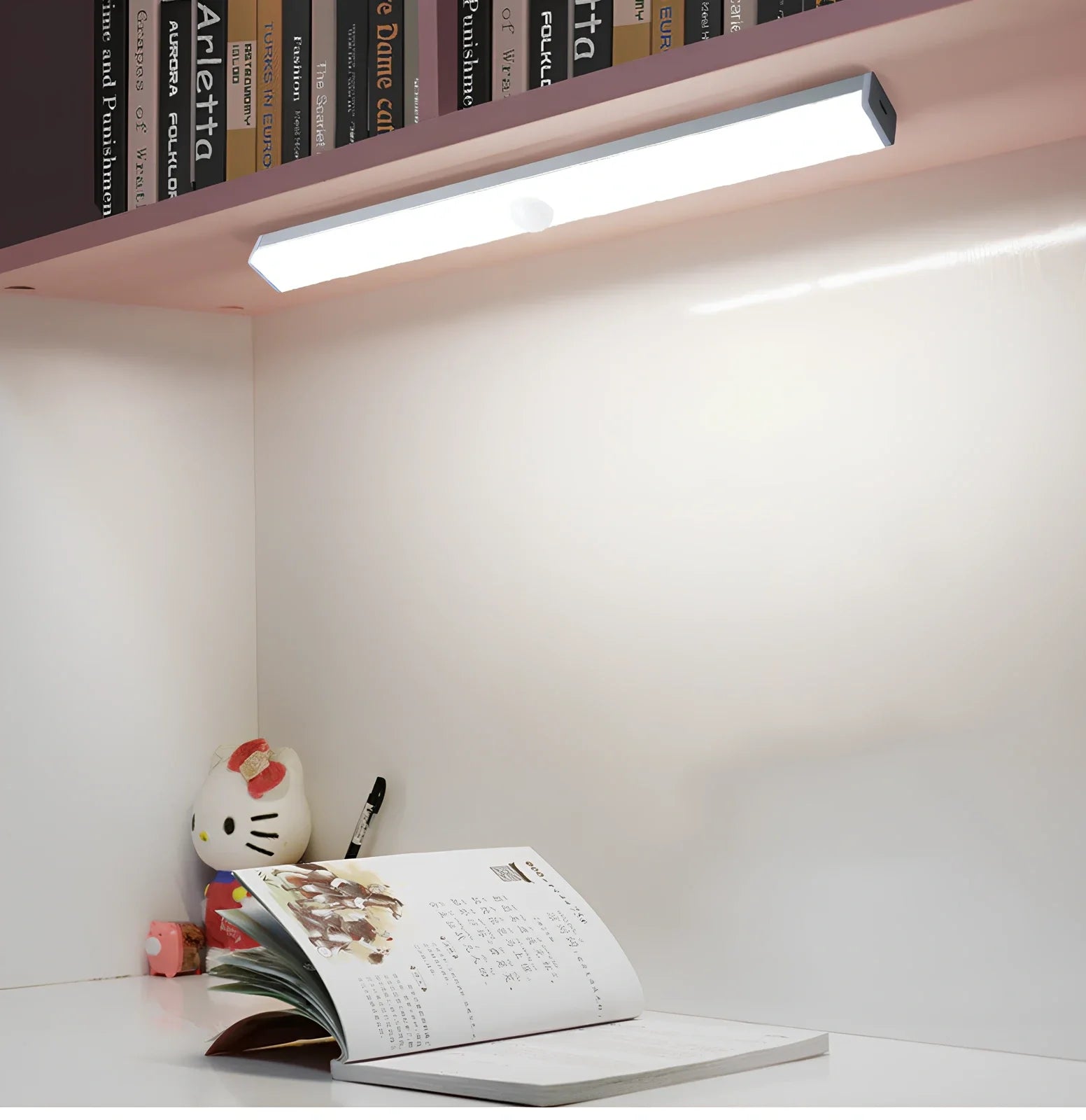 LED strip light with motion sensor in black finish, 30cm length with warm white illumination