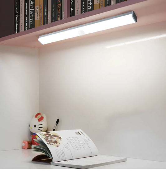 LED strip light with motion sensor in black finish, 30cm length with warm white illumination