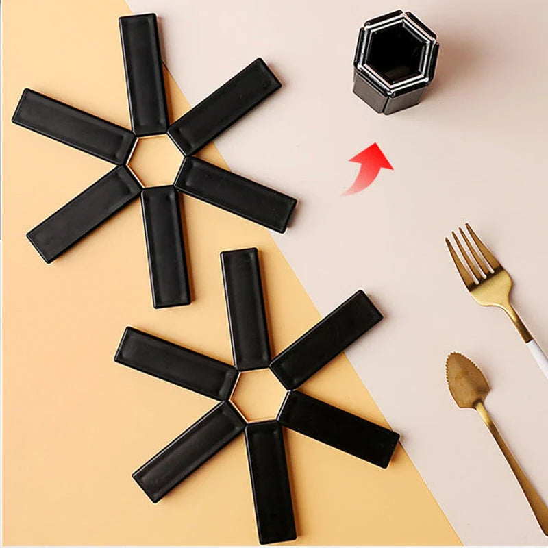 Versatile folding pan mat made of heat-resistant ABS material, with an anti-slip surface to protect kitchen surfaces from hot cookware