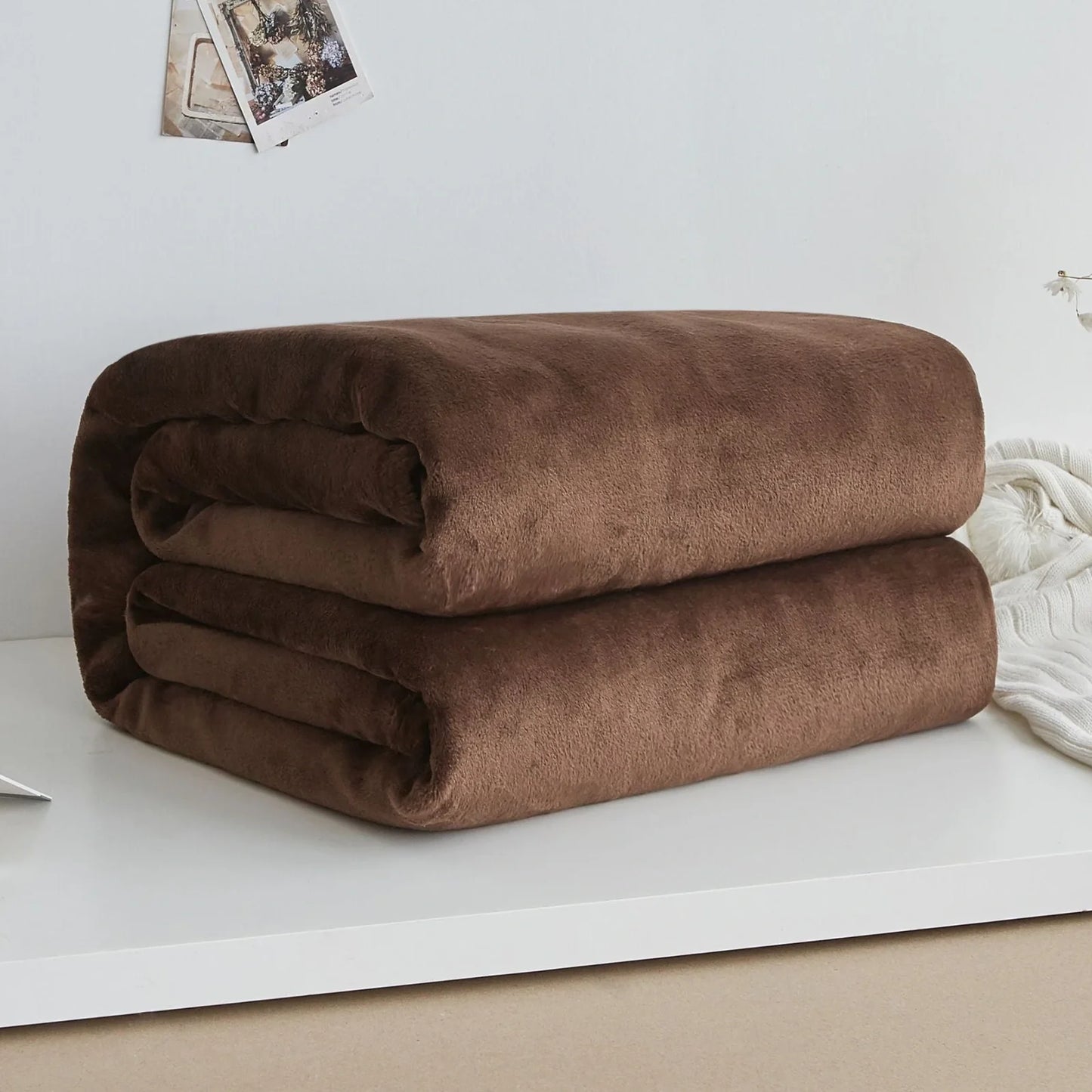 Coral fleece flannel blanket in beige showing textured surface and consistent edges