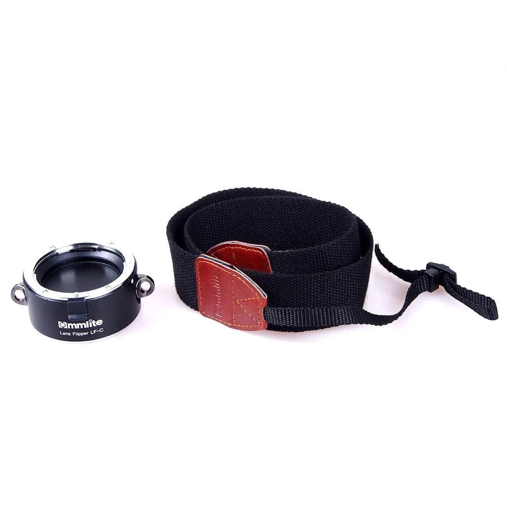 Aluminium alloy Nikon E-Mount lens flipper holding two camera lenses with cotton shoulder strap