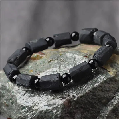Natural black tourmaline rough stone bracelet with stretch cord on wrist