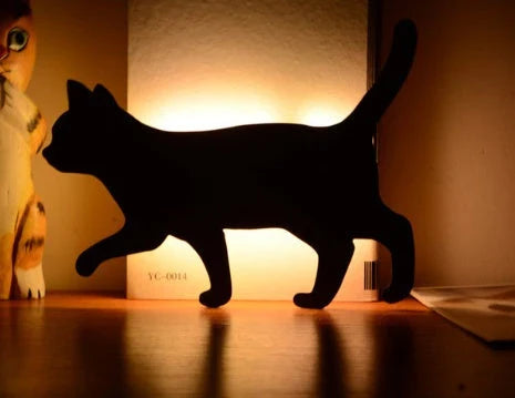 Assorted animal-shaped night lights with motion sensor, including a walking cat, mother and child cat, licking cat, looking back cat, and Pikachu
