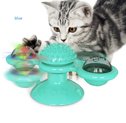 Cat rotating windmill toy with suction base, two transparent bins, blue and yellow-green TPR body.