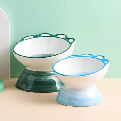 Ceramic oblique pet bowl with cartoon paw design for dogs