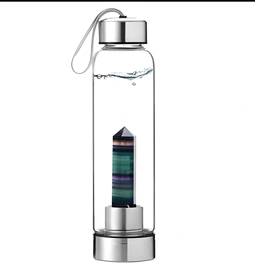Crystal infused glass water bottle with bamboo lid showing mineral crystal inside 25cm tall container