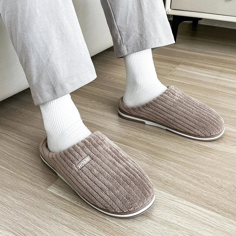 Cozy cotton slippers in various colors, featuring a soft, plush lining and non-slip rubber sole for indoor comfort and warmth