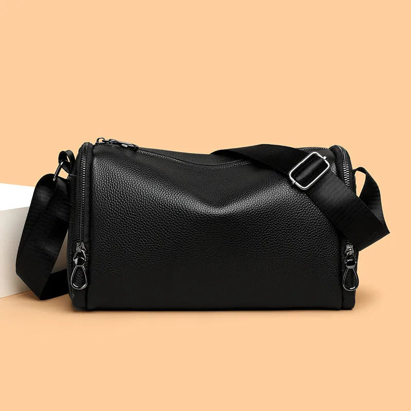 Genuine leather crossbody shoulder bag for men in black or brown with top grain cowhide and stitching detail