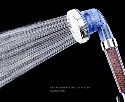 Pressurised shower head with stainless steel panel showing three water mode settings and removable nozzles