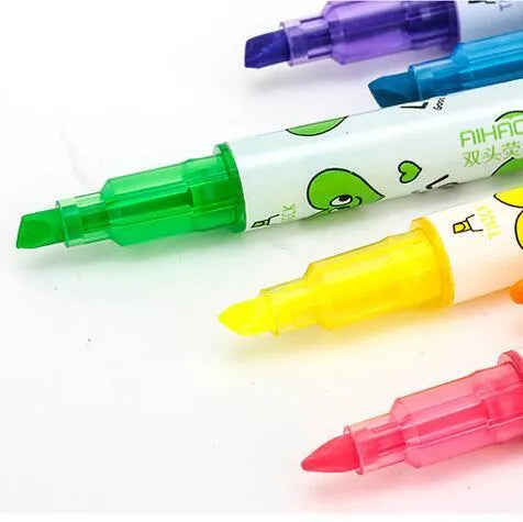 Six double-headed watercolour highlighter pens in assorted colours showing plug-in design.