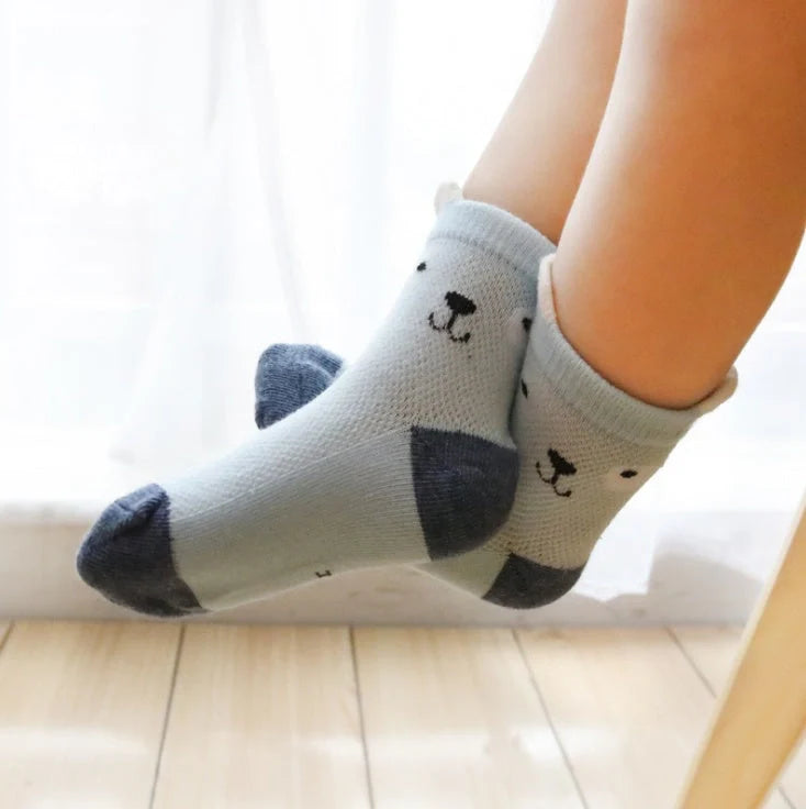 Vibrant 5-pack cotton kids' socks for boys and girls, perfect for summer comfort and style.